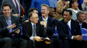 (left to right) Golden State Warriors' coaches Luke Walton, Ron Adams, Steve Kerr, Jarron Collins (2nd row), Alvin Gentry and Bruce Fraser (2nd row) enjoy a block by rookie James Michael McAdoo in 4th quarter of Warriors' 122-79 win over the Denver Nuggets during NBA game at Oracle Arena in Oakland, Calif. on Monday, January 19, 2015.