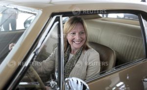 General Motors Co's Chief Executive Officer Mary Barra sits in a 1967 Camaro before the official debut of the all-new Chevrolet 2016 Camaro SIX at Belle Isle in Detroit, Michigan May 16, 2015. REUTERS/Rebecca Cook